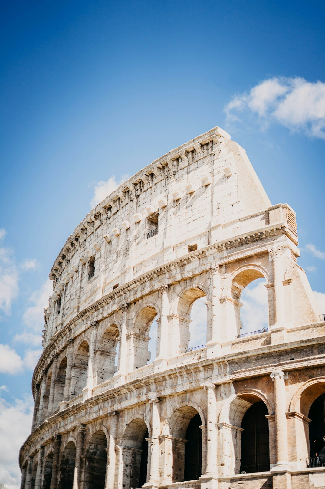 Colosseum in Rome under a blue sky