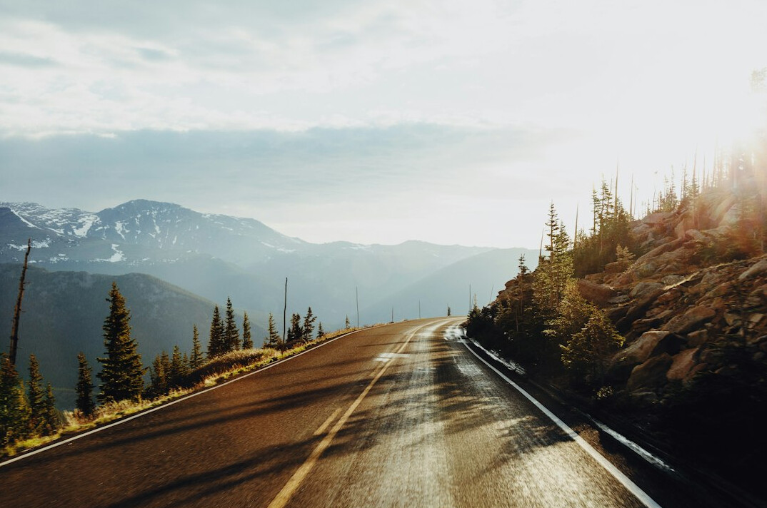 Winding road through mountains seen from a car