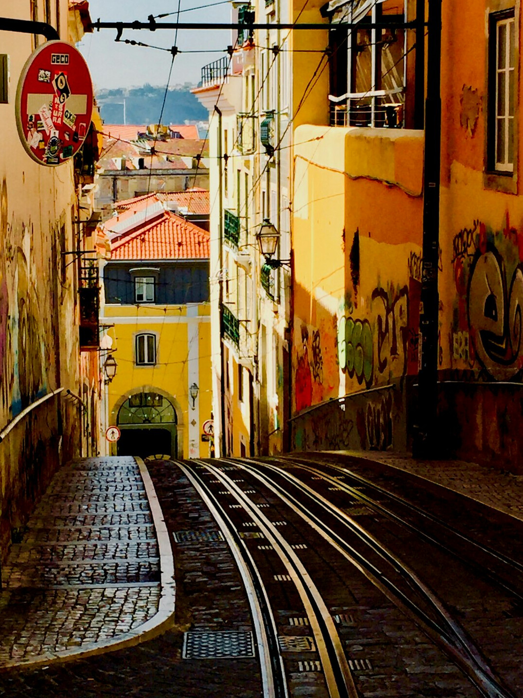 Colourful street with a yellow tram in Lisbon